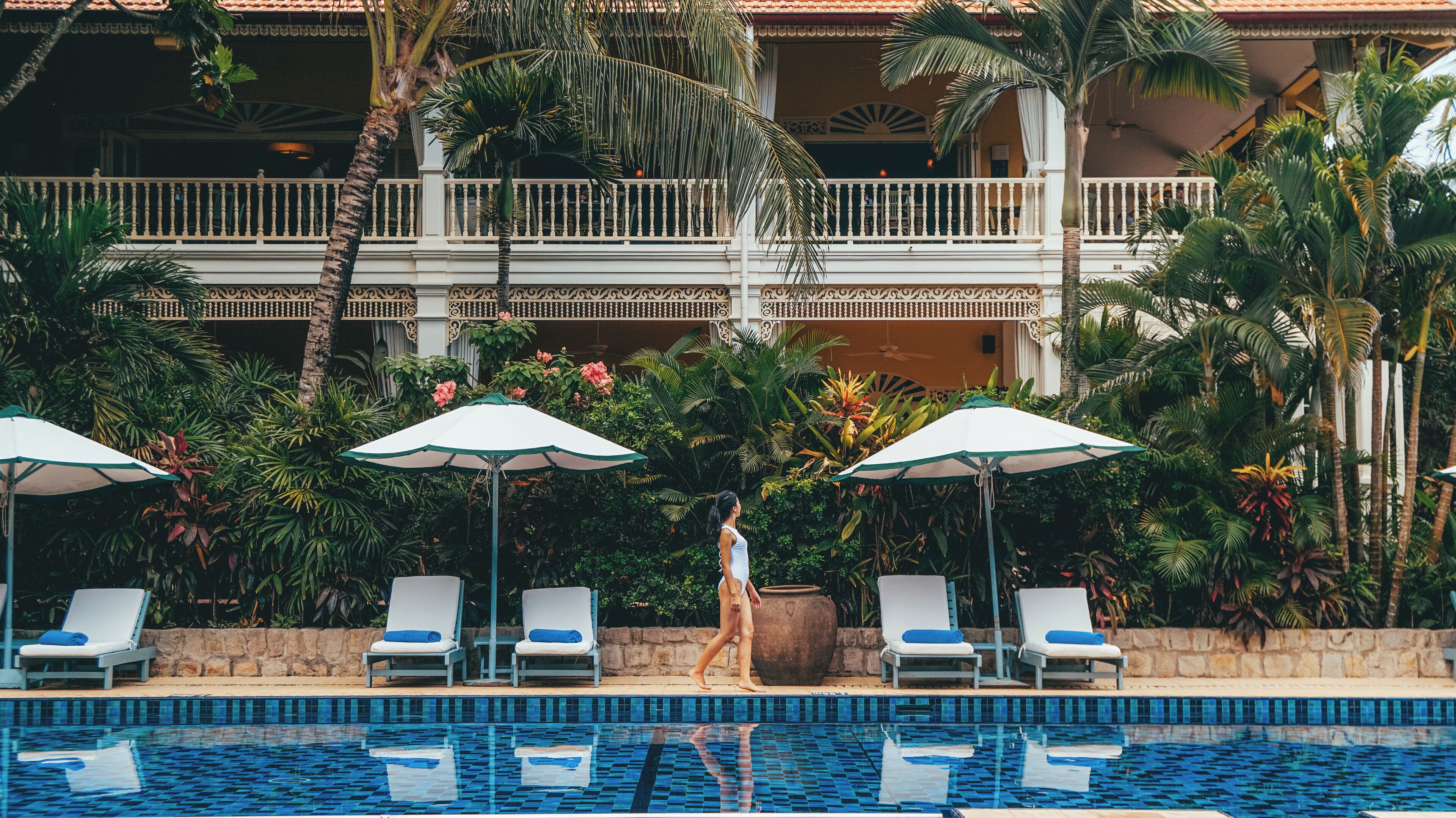 outdoor pool, open 7:00 am to 7:00 pm, pool umbrellas, pool loungers