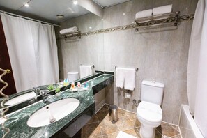 Separate bathtub and shower, designer toiletries, hair dryer, towels