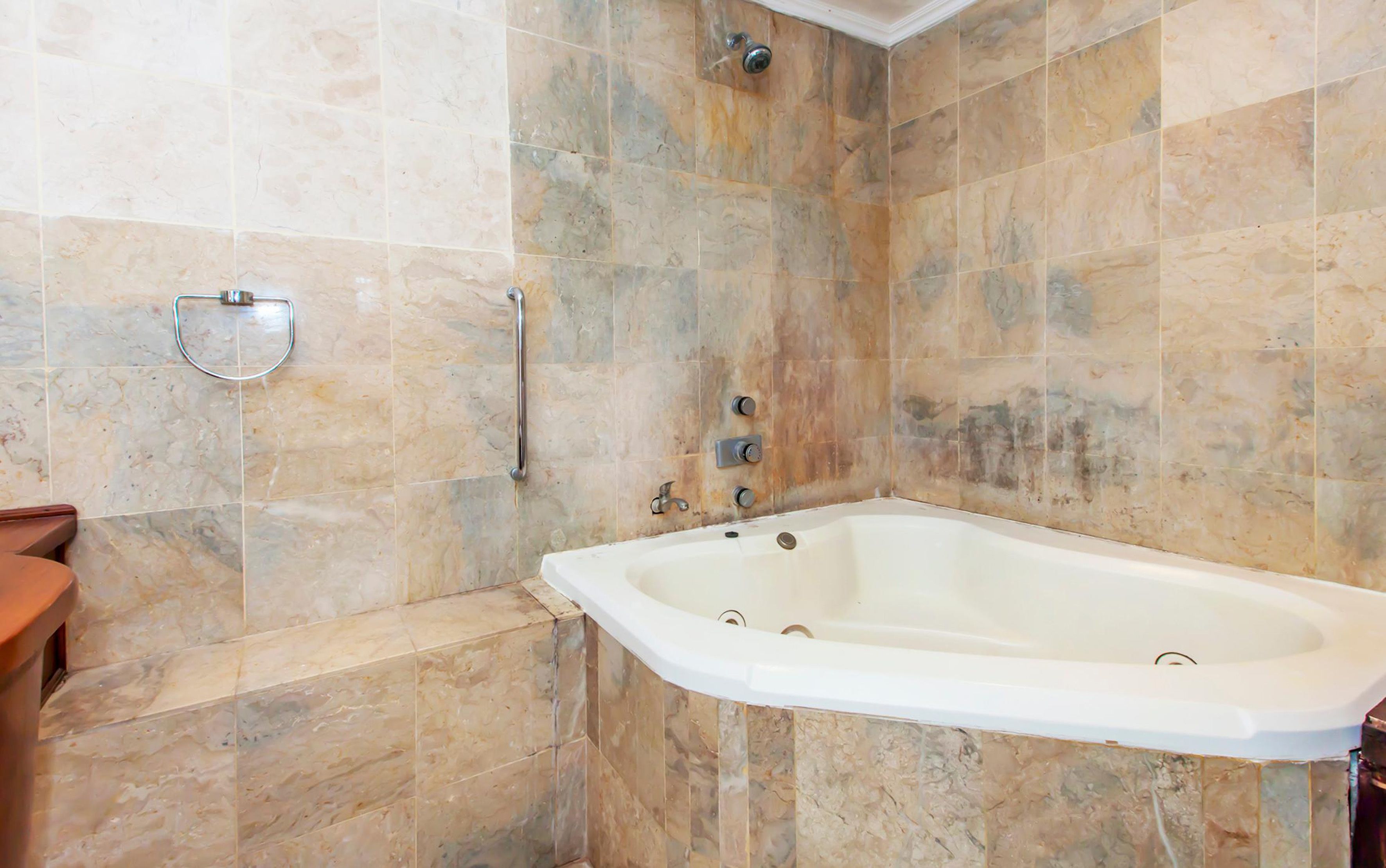executive suite, 1 double bed, balcony, river view | bathroom | separate bathtub and shower, hair dryer, bathrobes, towels