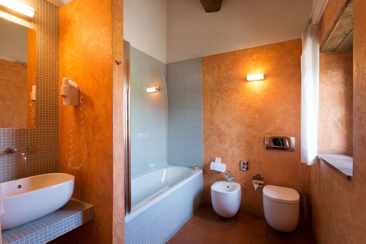 superior double room | bathroom | free toiletries, hair dryer, bidet, towels