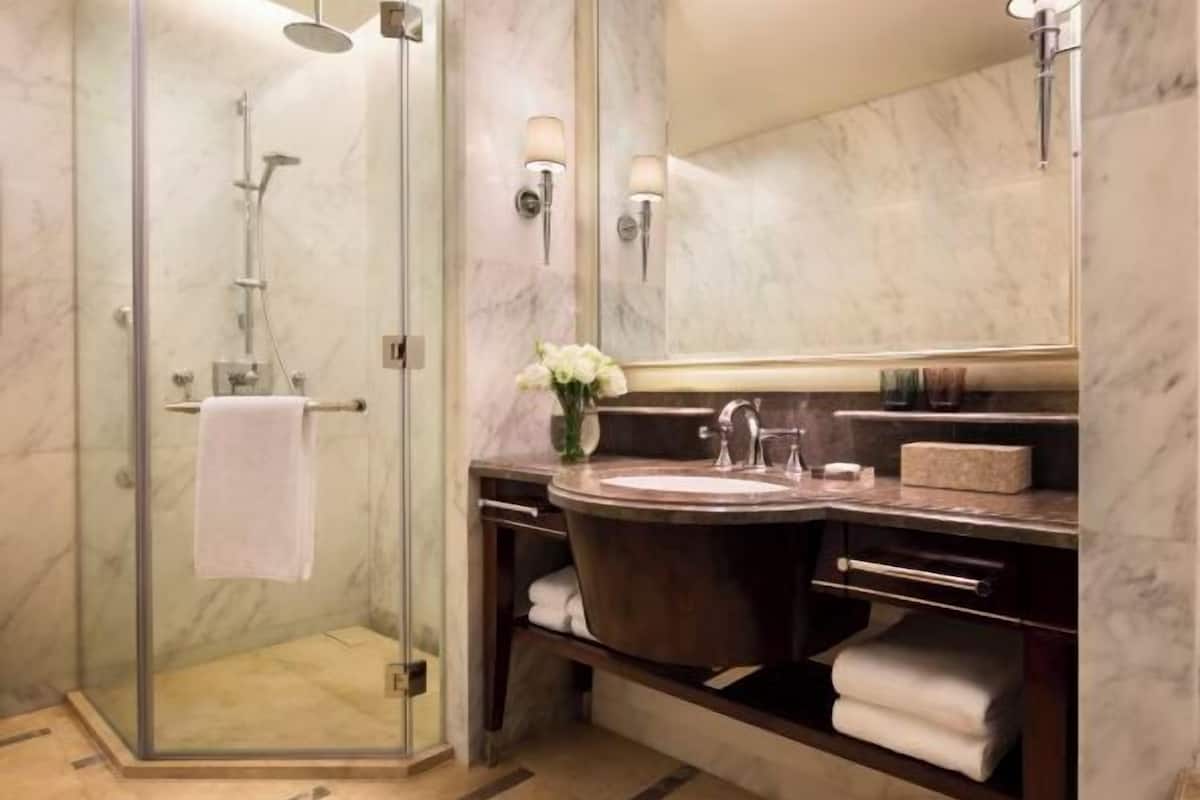 deluxe room, 1 king bed | bathroom | separate bathtub and shower, deep-soaking bathtub