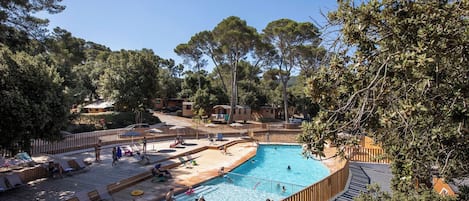 Seasonal outdoor pool, open 9:00 AM to 6:00 PM, pool umbrellas