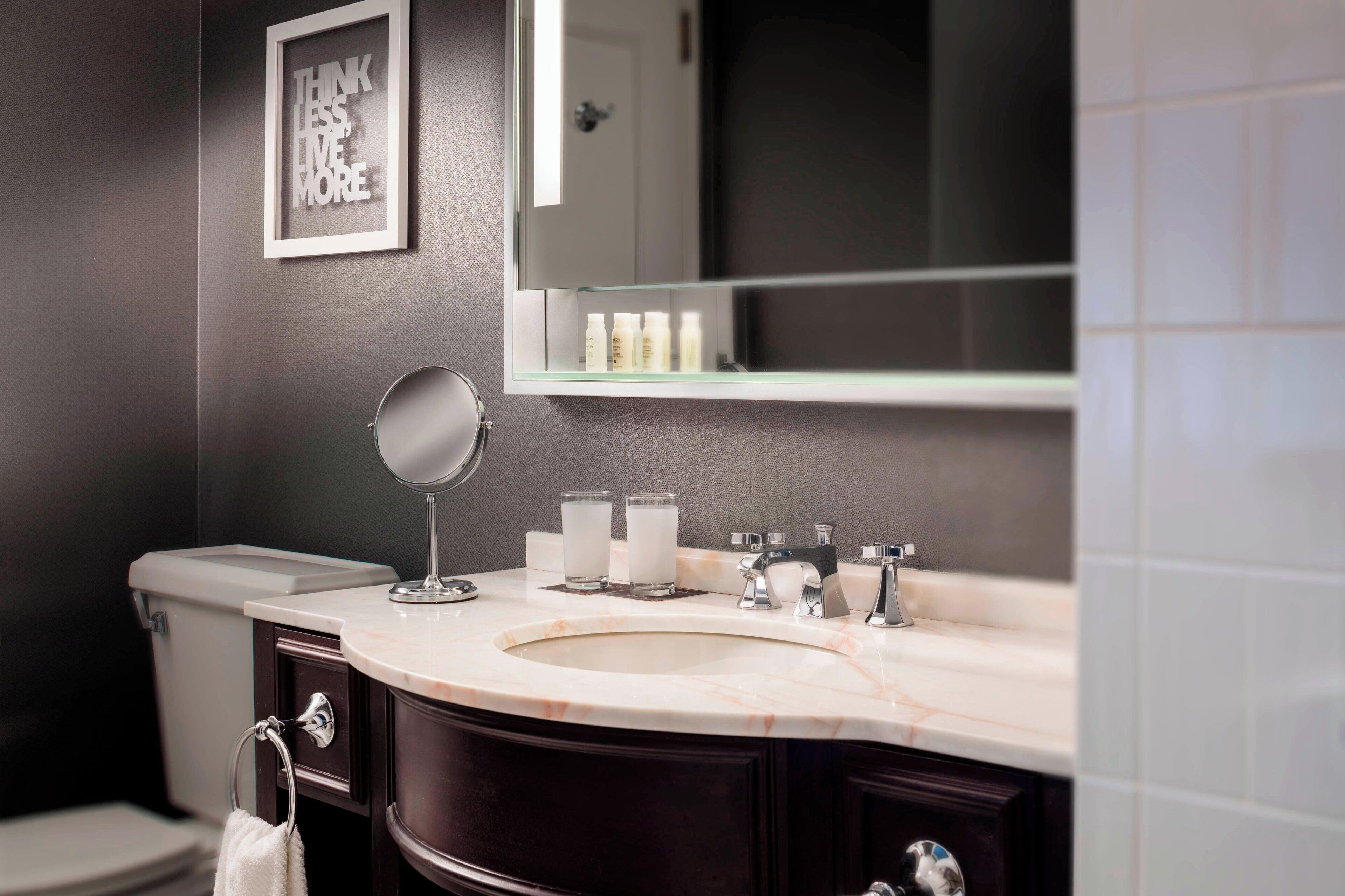 combined shower/bathtub, designer toiletries, hair dryer, towels