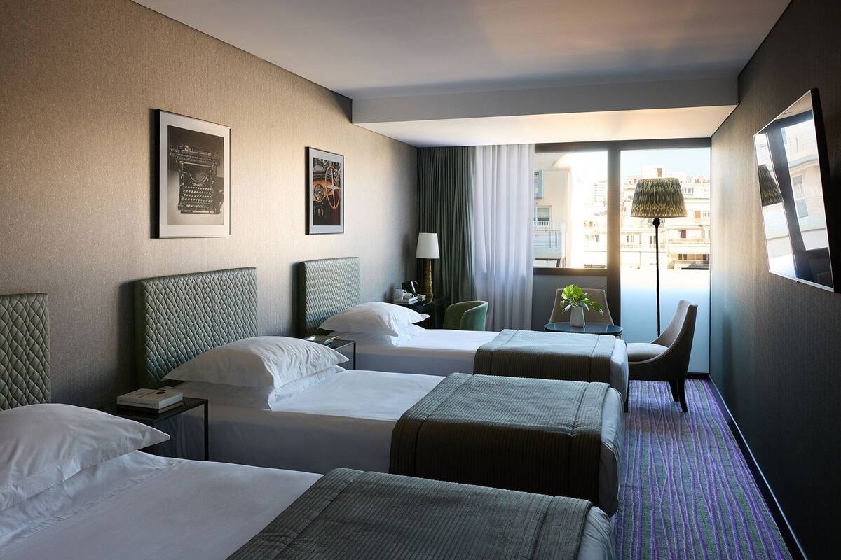 Panoramic 3 Single Classic Triple Room, City View | Hypo-allergenic bedding available, in-room safe, blackout drapes