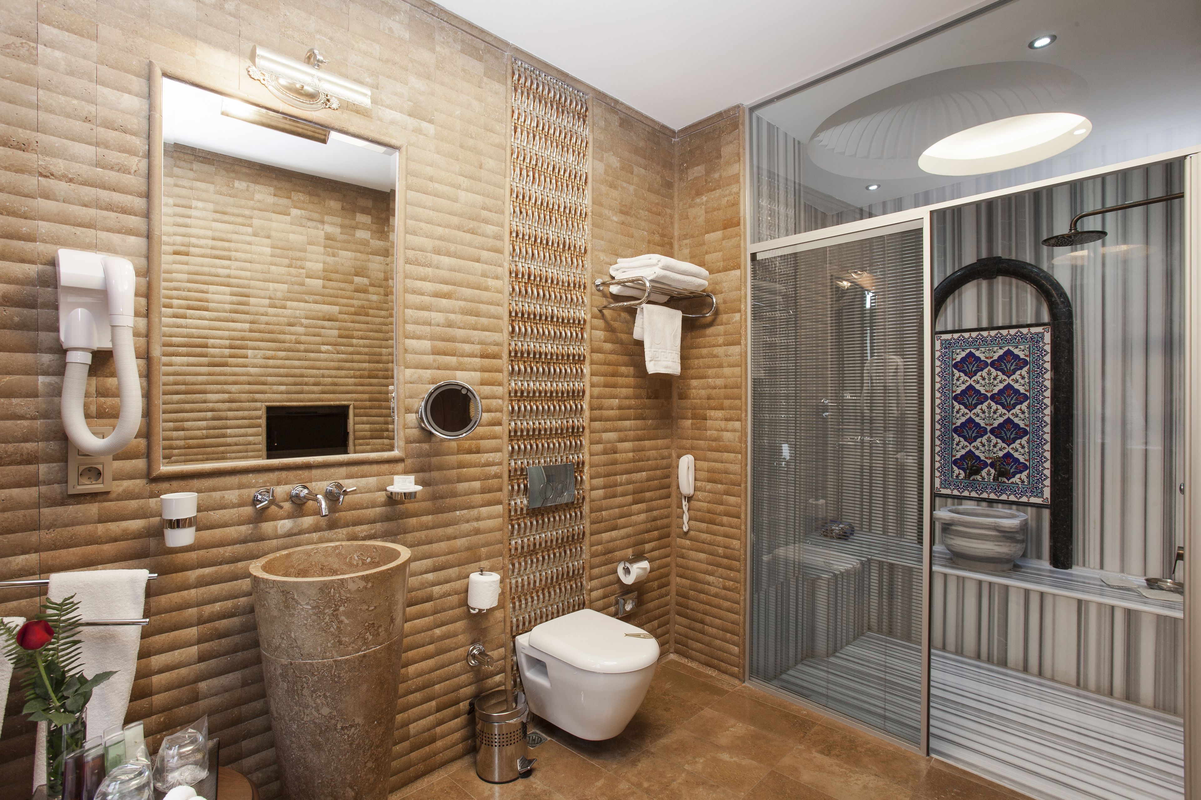 premium sultan junior suite | bathroom | designer toiletries, hair dryer, bathrobes, slippers