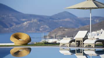 Seasonal outdoor pool, open 9:30 AM to 9 PM, pool umbrellas