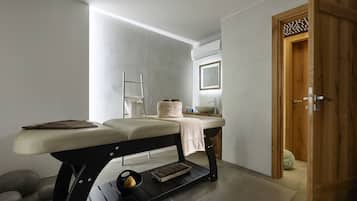 Bathroom features a clean design with a wooden bench, sink, and mirror.