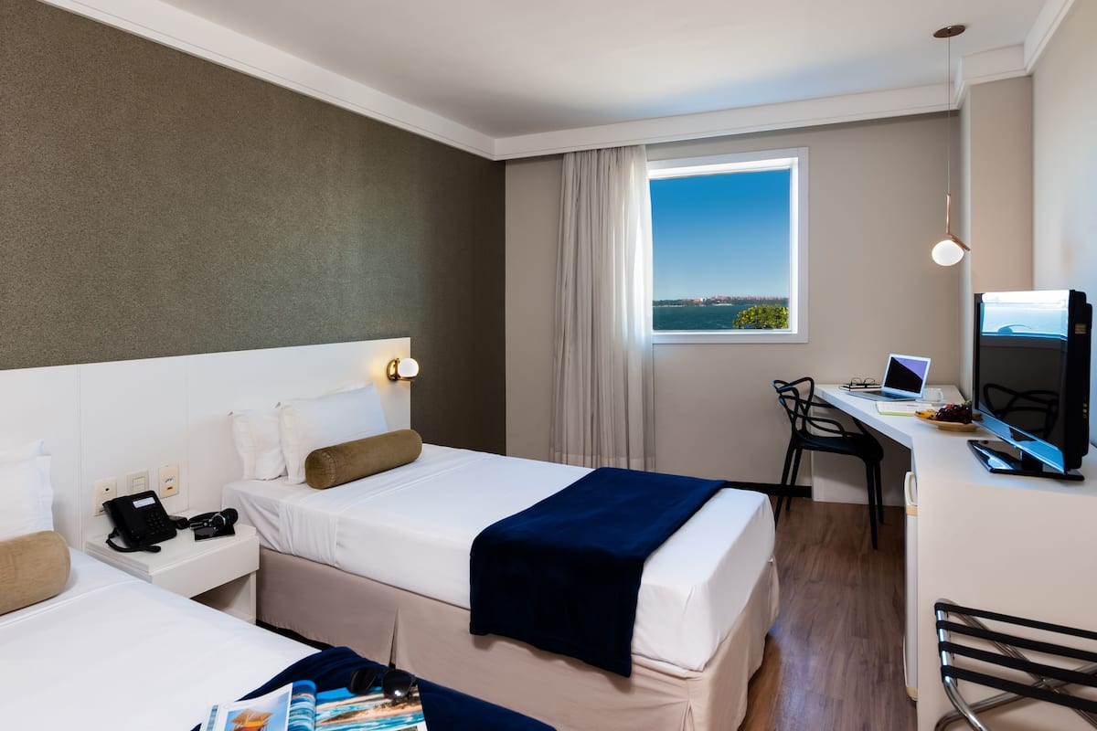 Deluxe Twin Room, 2 Single Beds | Minibar, in-room safe, desk, blackout curtains
