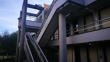 A multi-level building with a staircase connecting different floors.