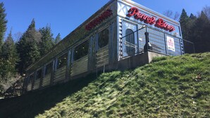 A diner with a classic design, featuring large windows and a prominent red sign. - Travelodge by Wyndham Dunsmuir (Dunsmuir)