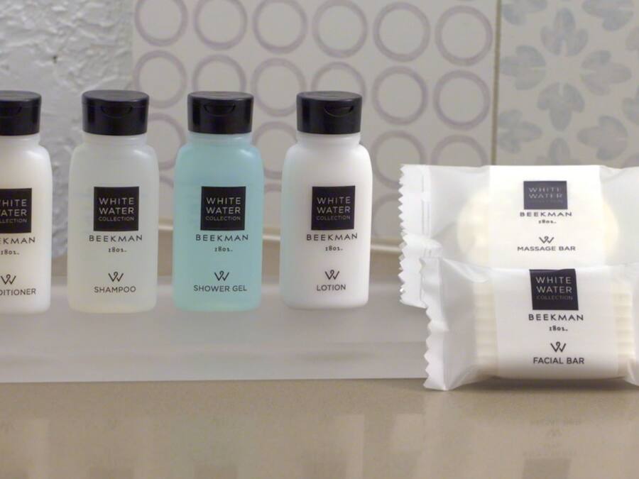 A display of White Water Collection products including conditioner, shampoo, shower gel, and lotion.