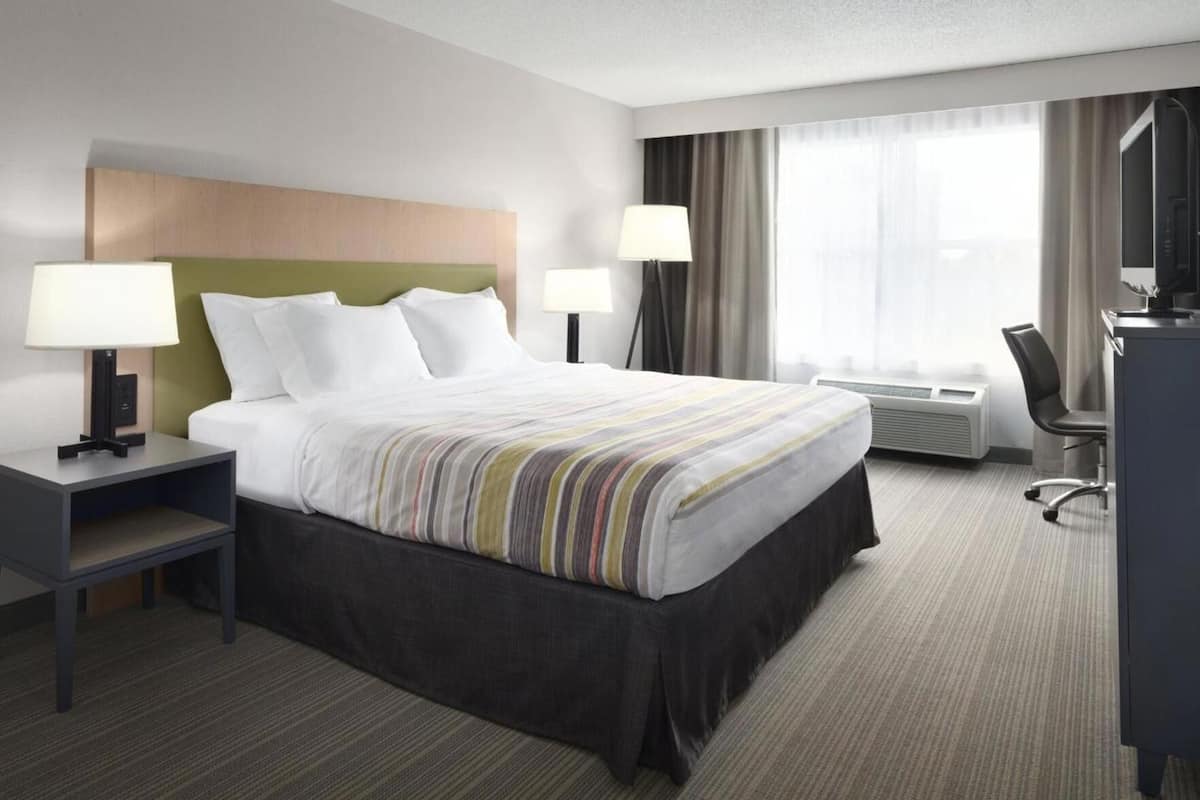 Roupas de cama premium, cofres nos quartos, escrivaninha