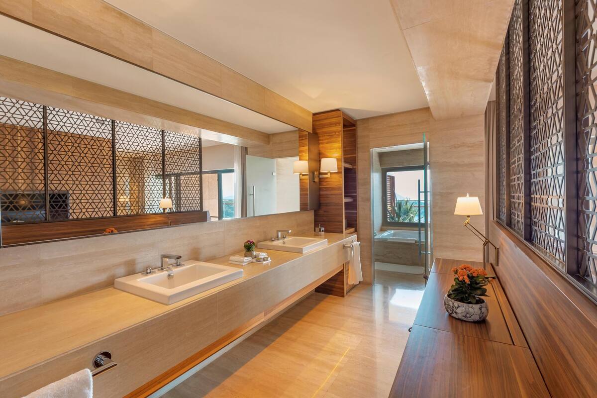 designer toiletries, hair dryer, bathrobes, slippers