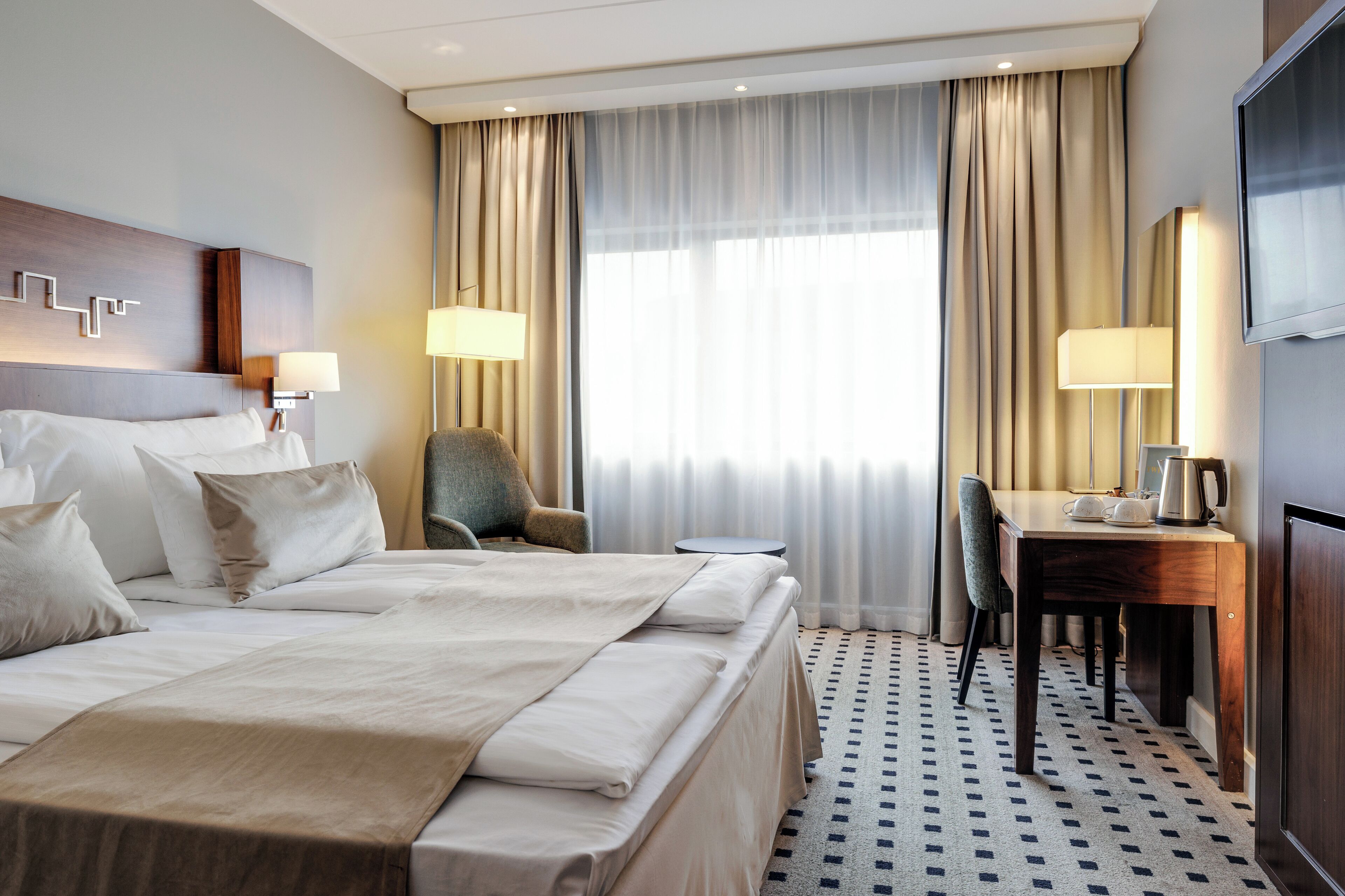 premium bedding, pillow-top beds, desk, laptop workspace