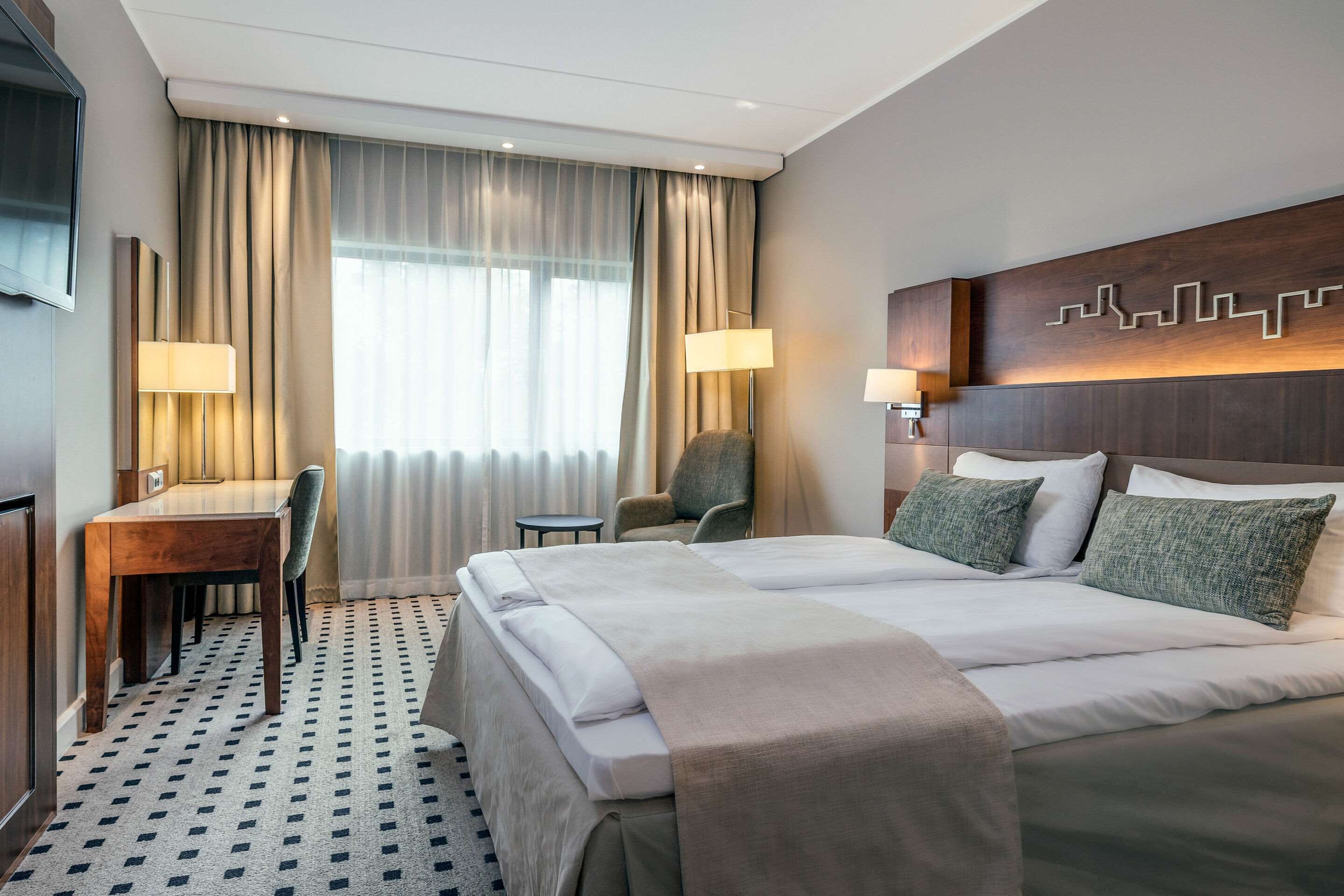 Premium bedding, pillow-top beds, desk, laptop workspace