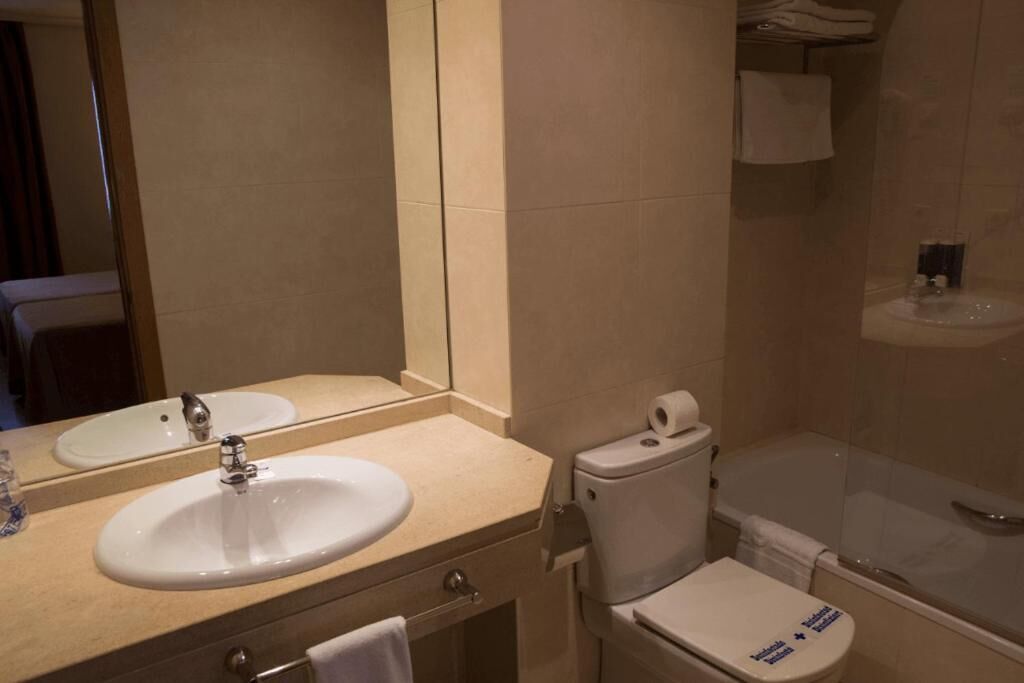 bathtub, hair dryer, towels