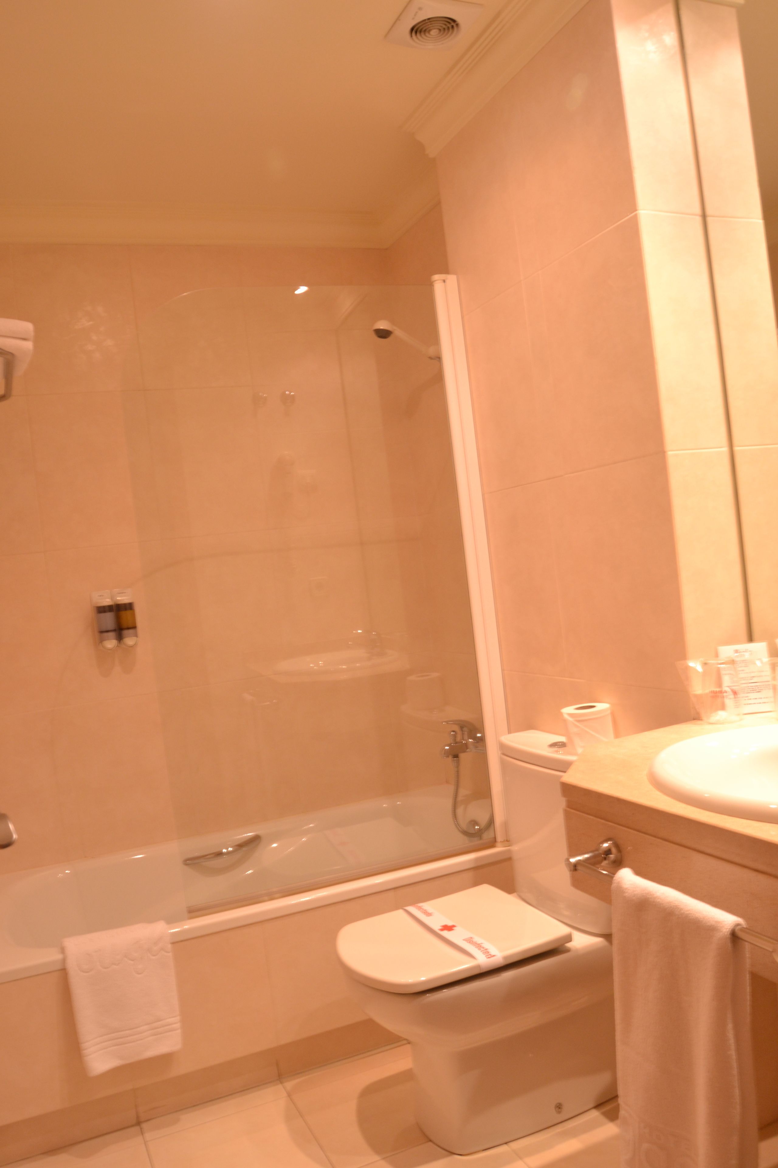 bathtub, hair dryer, towels