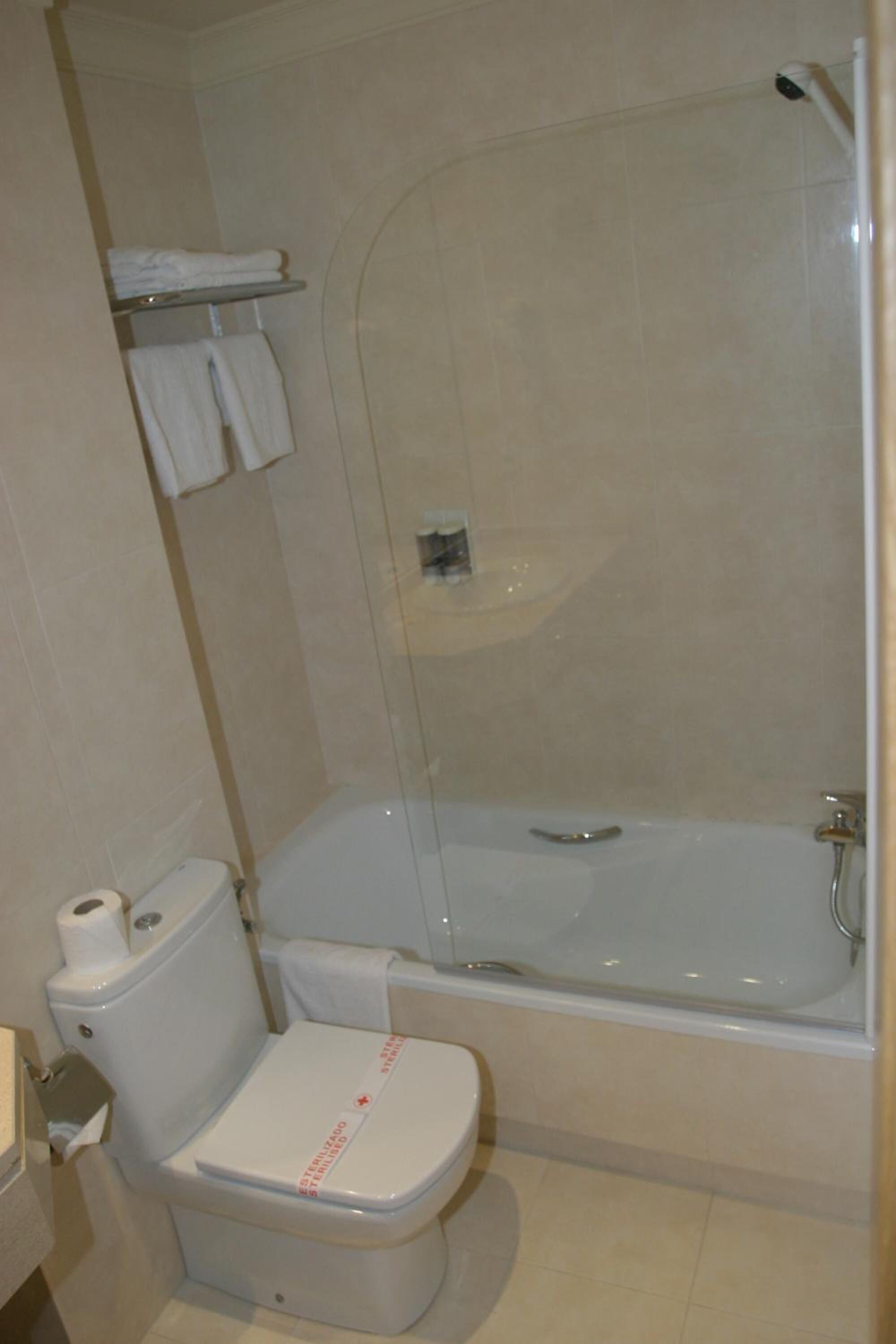 bathtub, hair dryer, towels