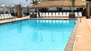 Seasonal outdoor pool, open 10:00 AM to 8:00 PM, pool loungers