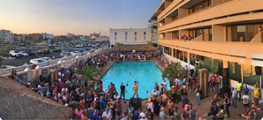 Seasonal outdoor pool, open 10:00 AM to 8:00 PM, pool loungers