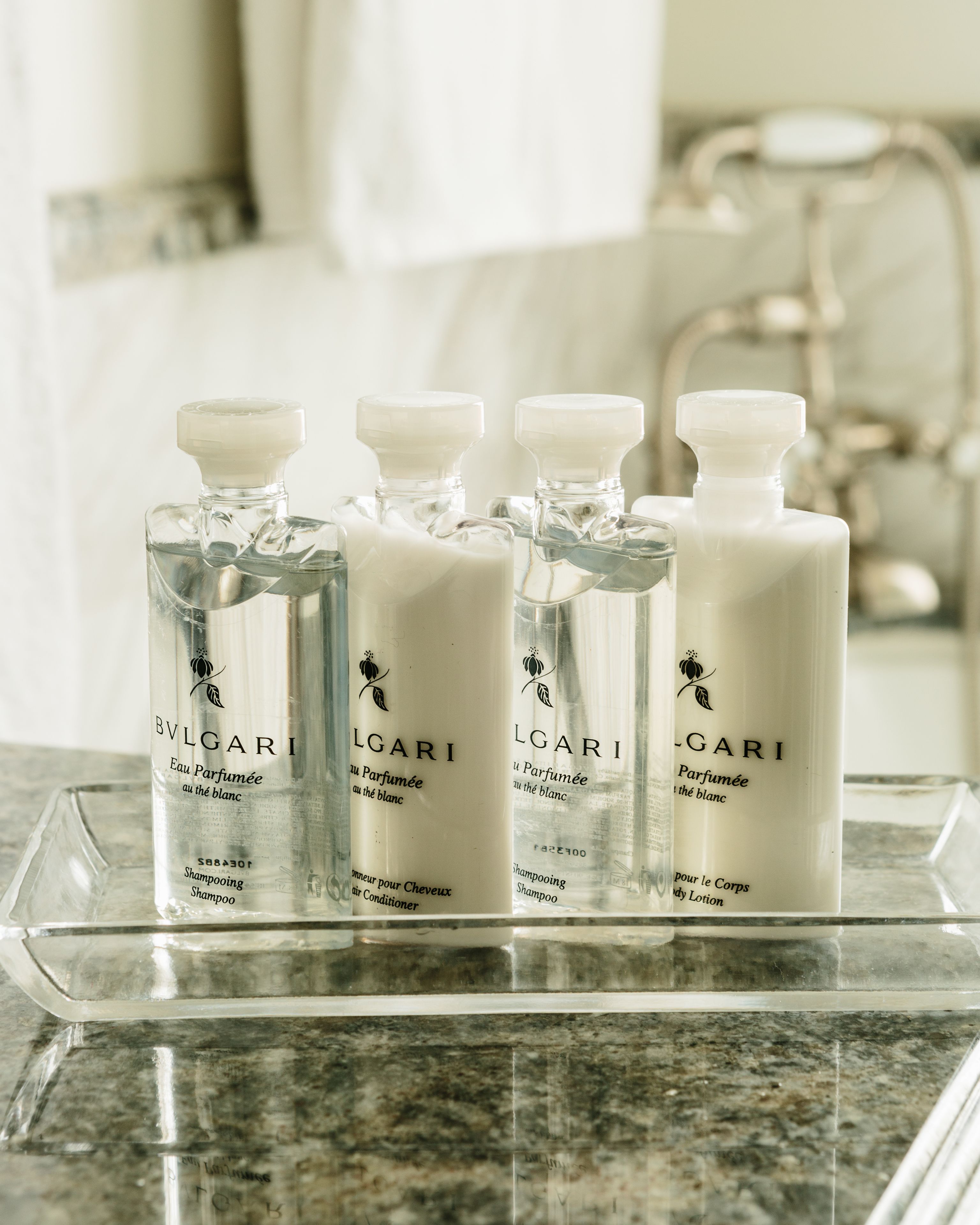 designer toiletries, hair dryer, bathrobes, slippers