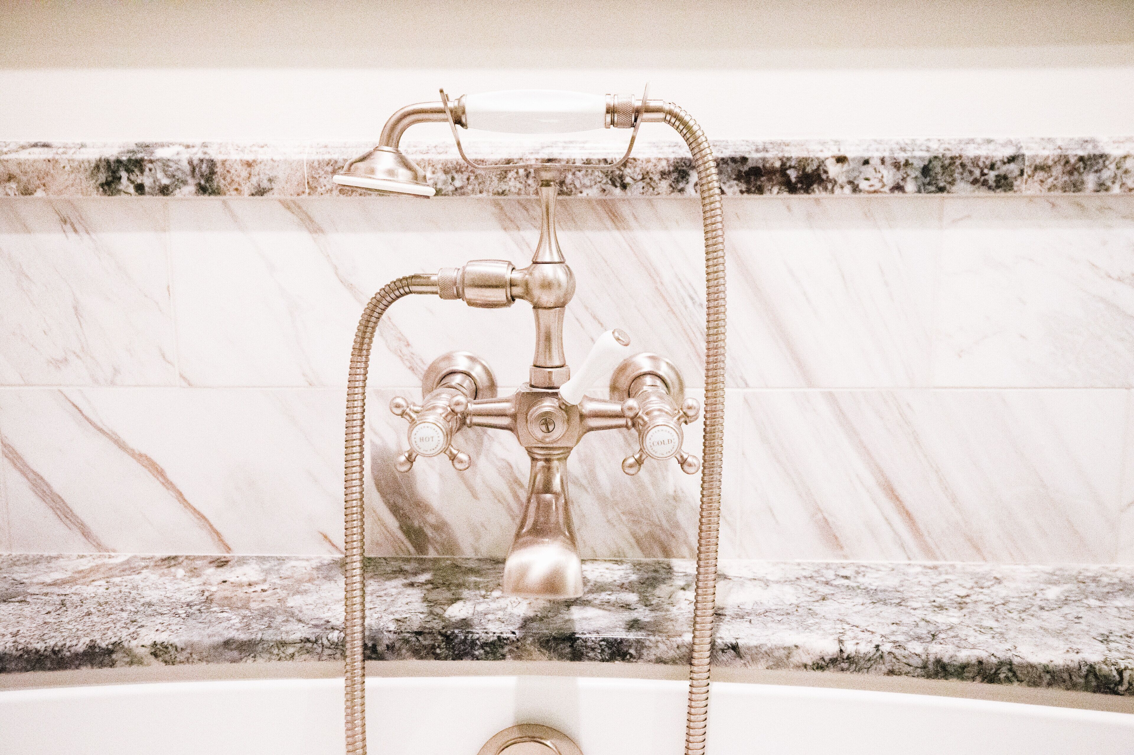 designer toiletries, hair dryer, bathrobes, slippers