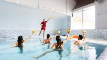 Relax by the pool, where a large window brings in plenty of natural light and offers a game area with a pool table.