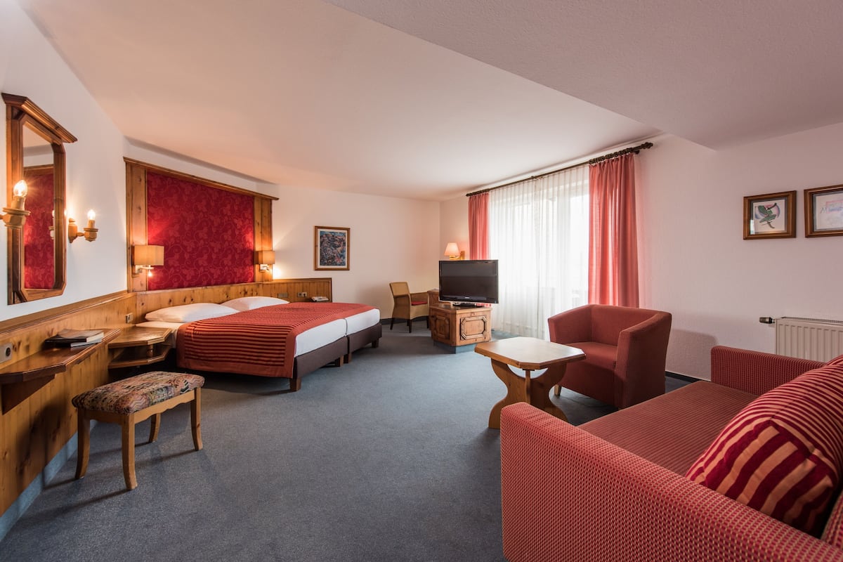 Deluxe Double Room | Living area | Flat-screen TV