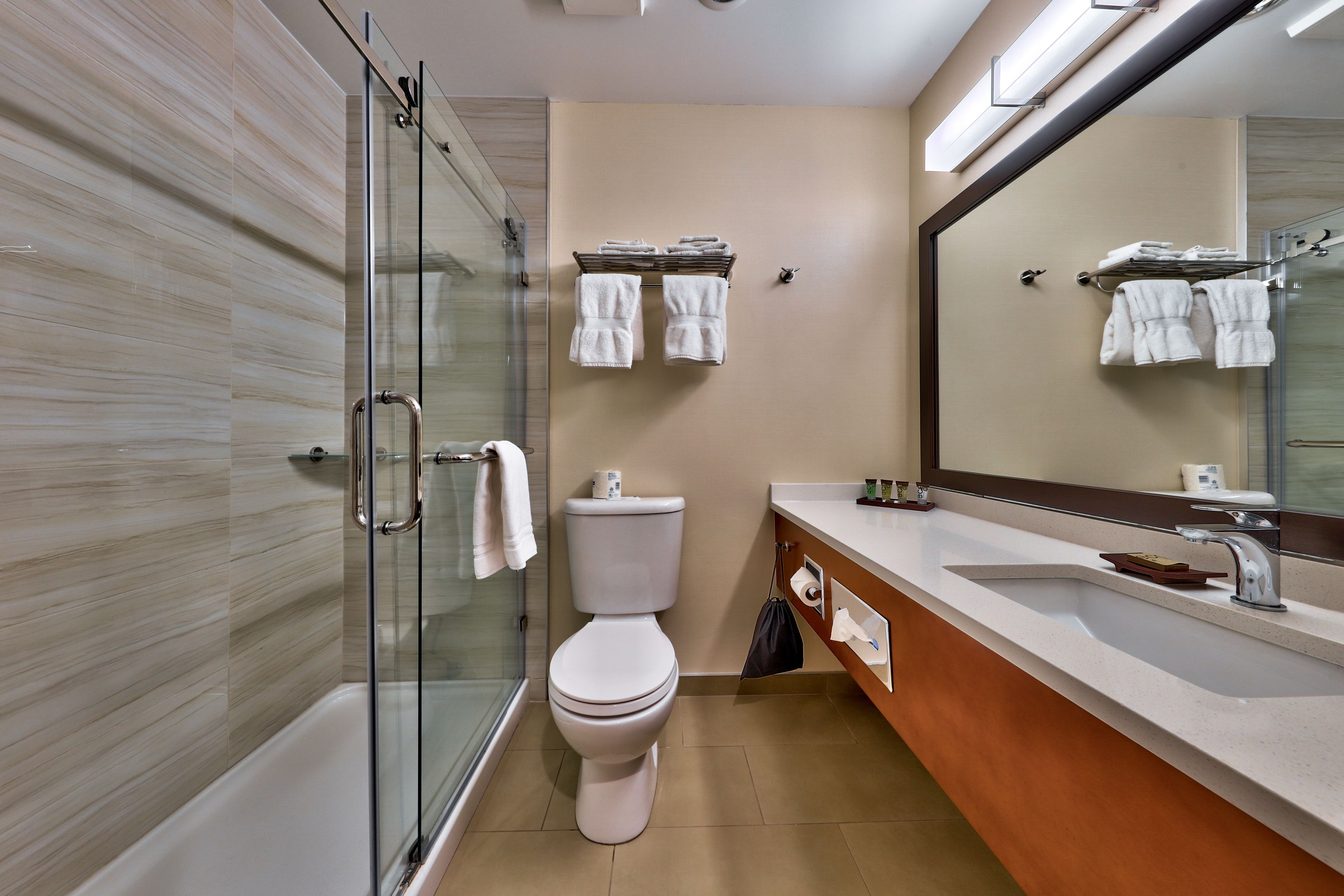 comfort room, 2 queen beds | bathroom | shower, rainfall showerhead, free toiletries, hair dryer