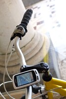 A bicycle with a Garmin device mounted on the handlebars.