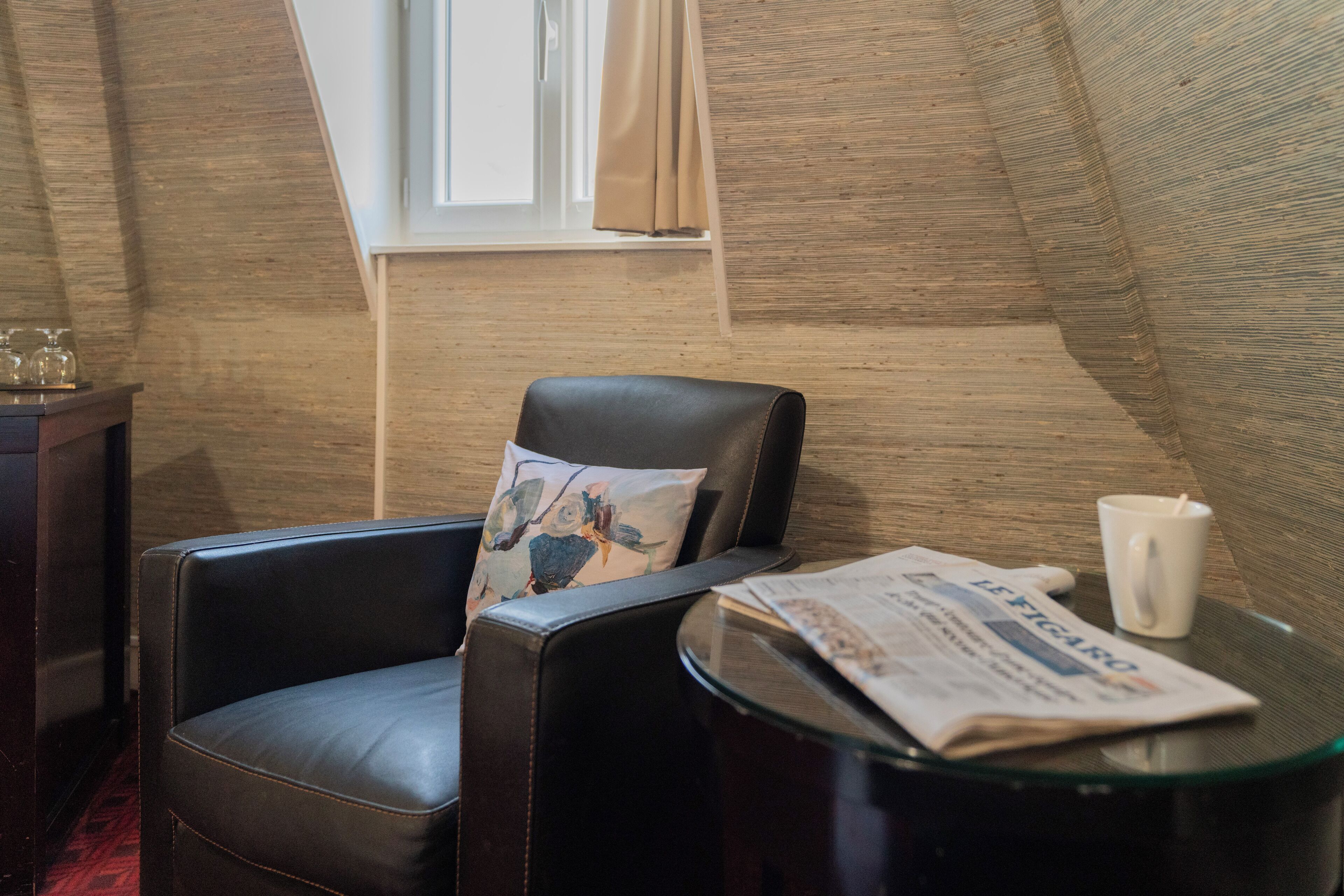 deluxe triple room | living area | flat-screen tv