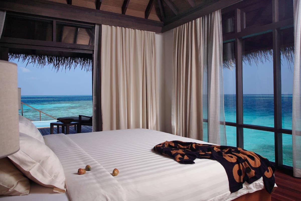 escape water villa with private pool | premium bedding, minibar, in-room safe, desk