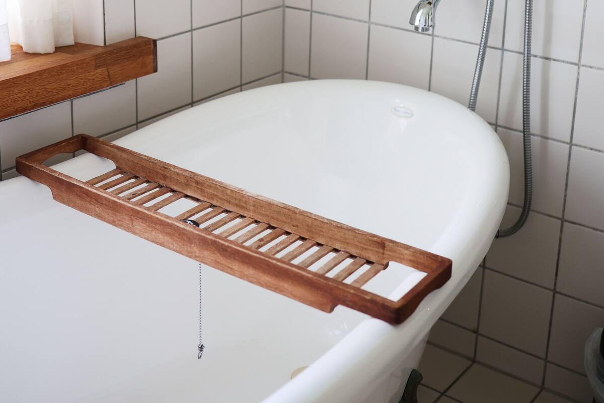 medium with bathtub | bathroom | eco-friendly toiletries, hair dryer, towels, soap