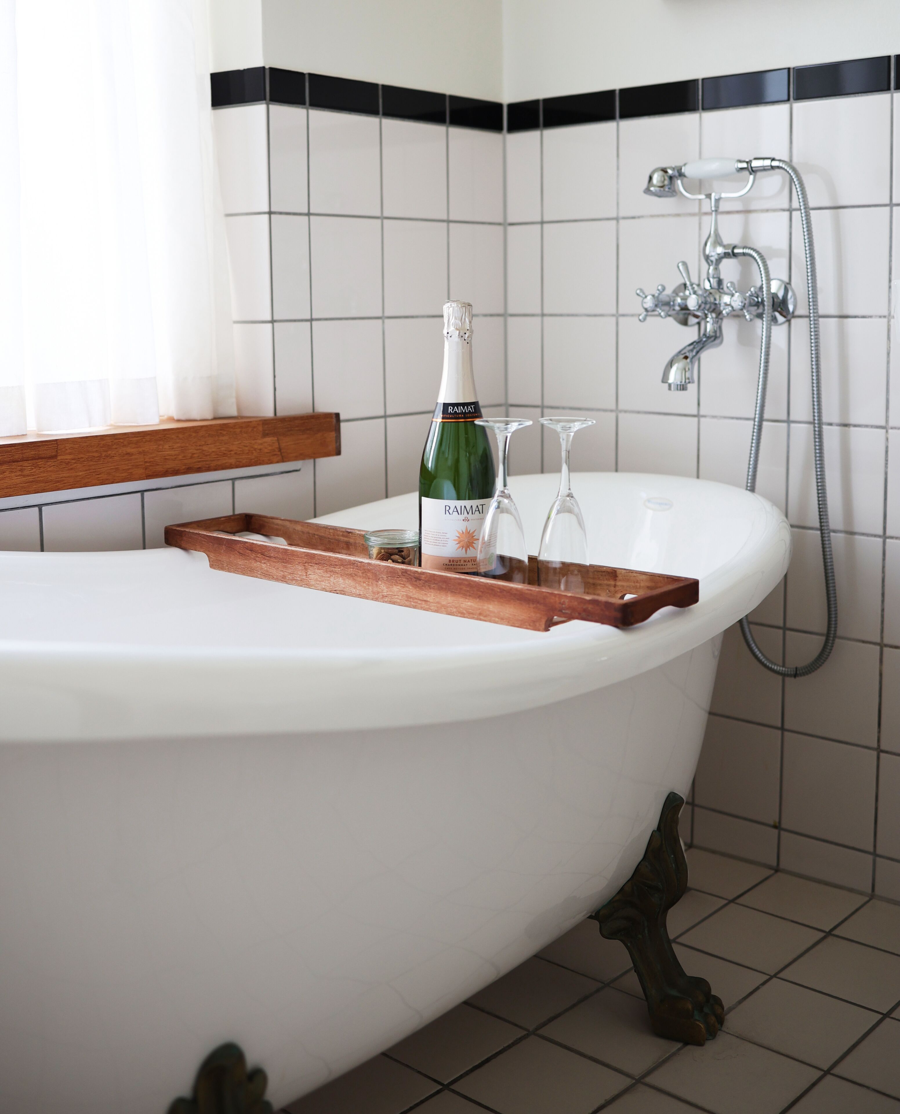 medium with bathtub | bathroom | eco-friendly toiletries, hair dryer, towels, soap