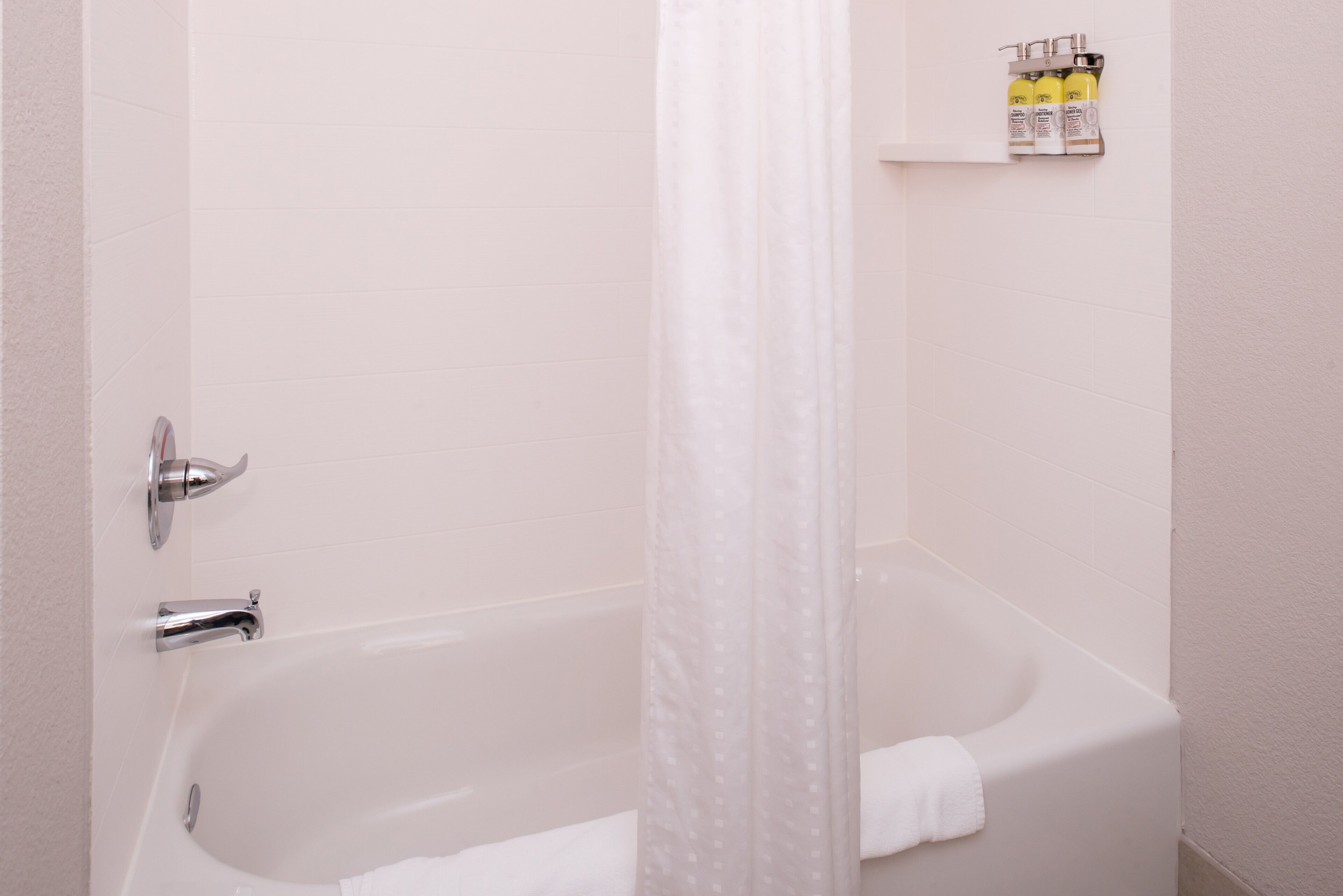 bathtub, hair dryer, towels