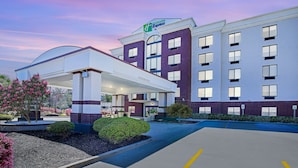 A Holiday Inn Express hotel with a gas station, parking, and landscaped areas. - Holiday Inn Express Hotel & Suites Birmingham - Inverness by IHG (Birmingham)