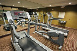 A fitness center with treadmills, ellipticals, and a stationary bike. - Holiday Inn Express Hotel & Suites Birmingham - Inverness by IHG (Birmingham)