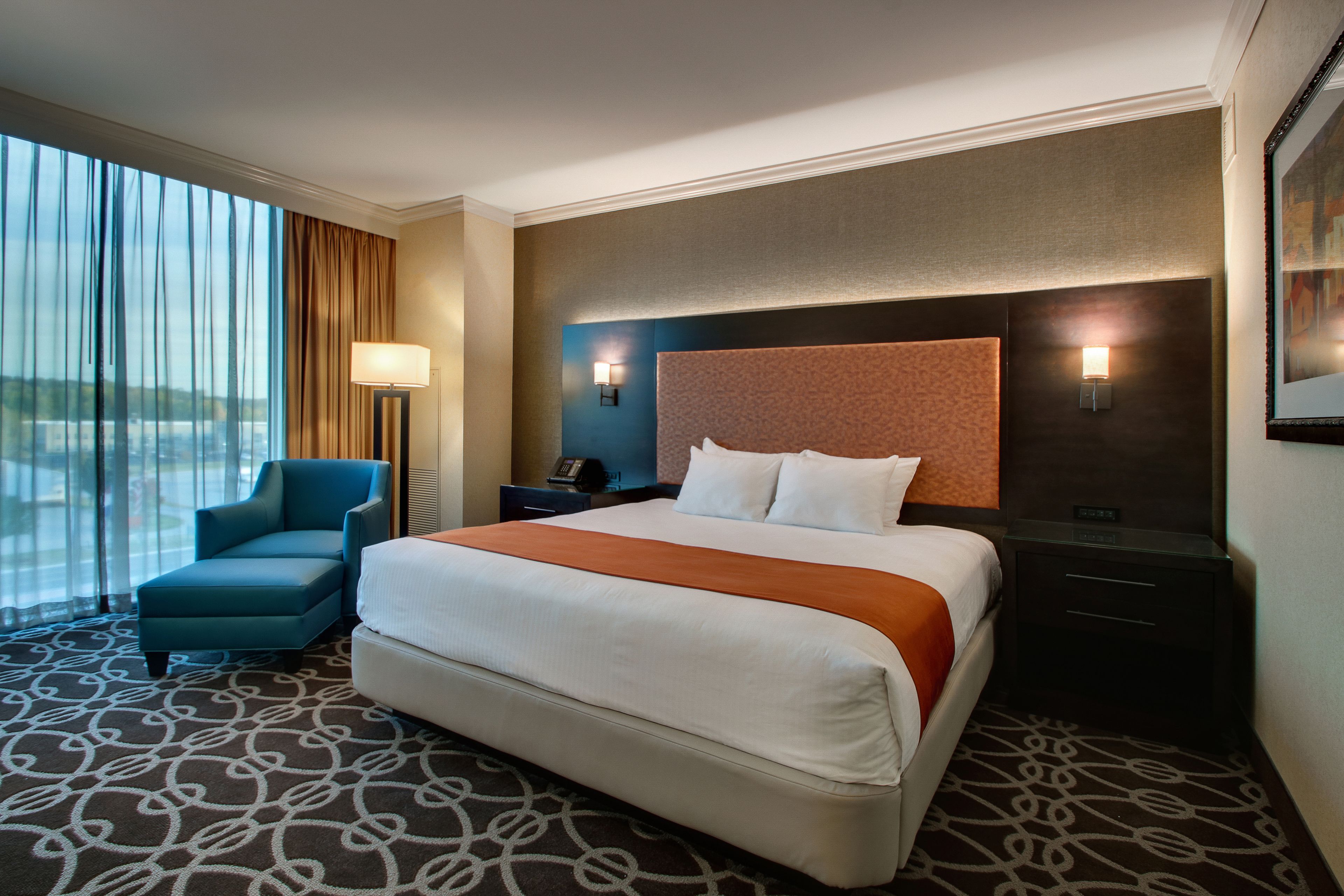 deluxe room, 1 king bed | premium bedding, pillow-top beds, in-room safe, desk