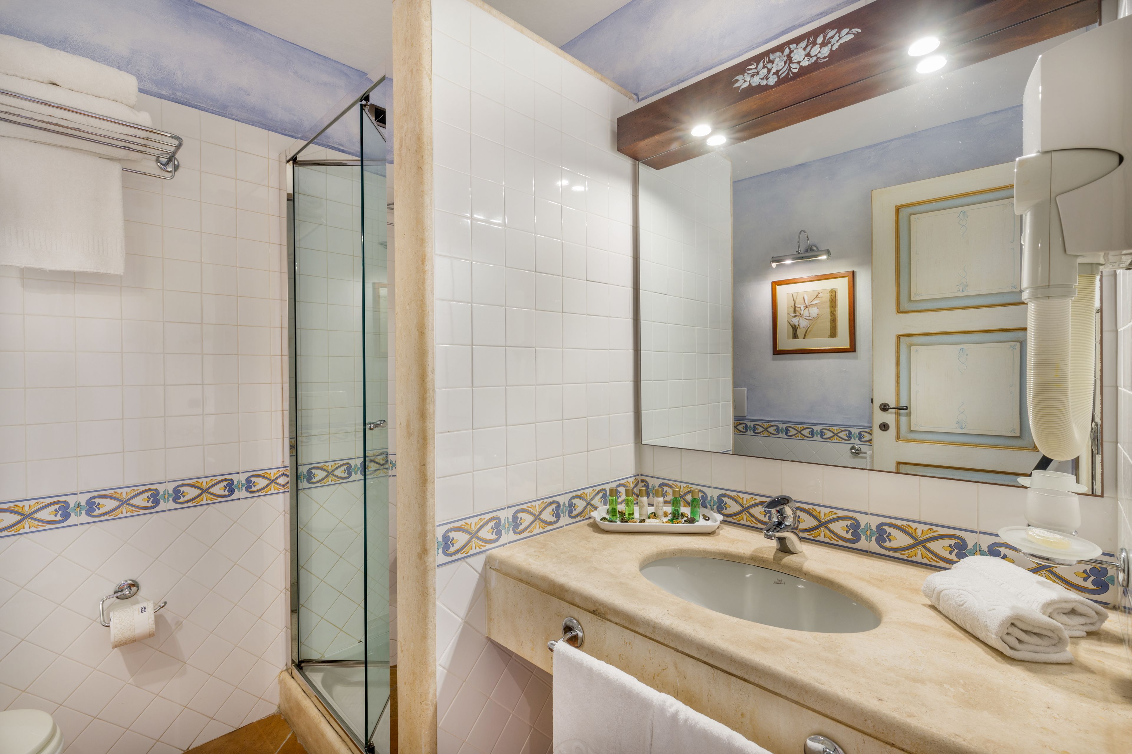 designer toiletries, hair dryer, bidet, towels