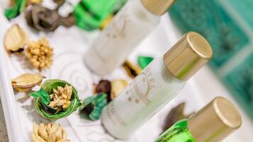 A tray with bottles and dried flowers.