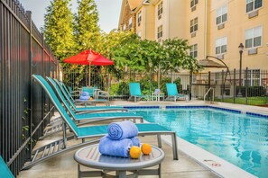 Outdoor pool, open noon to 9:00 PM, pool umbrellas, pool loungers