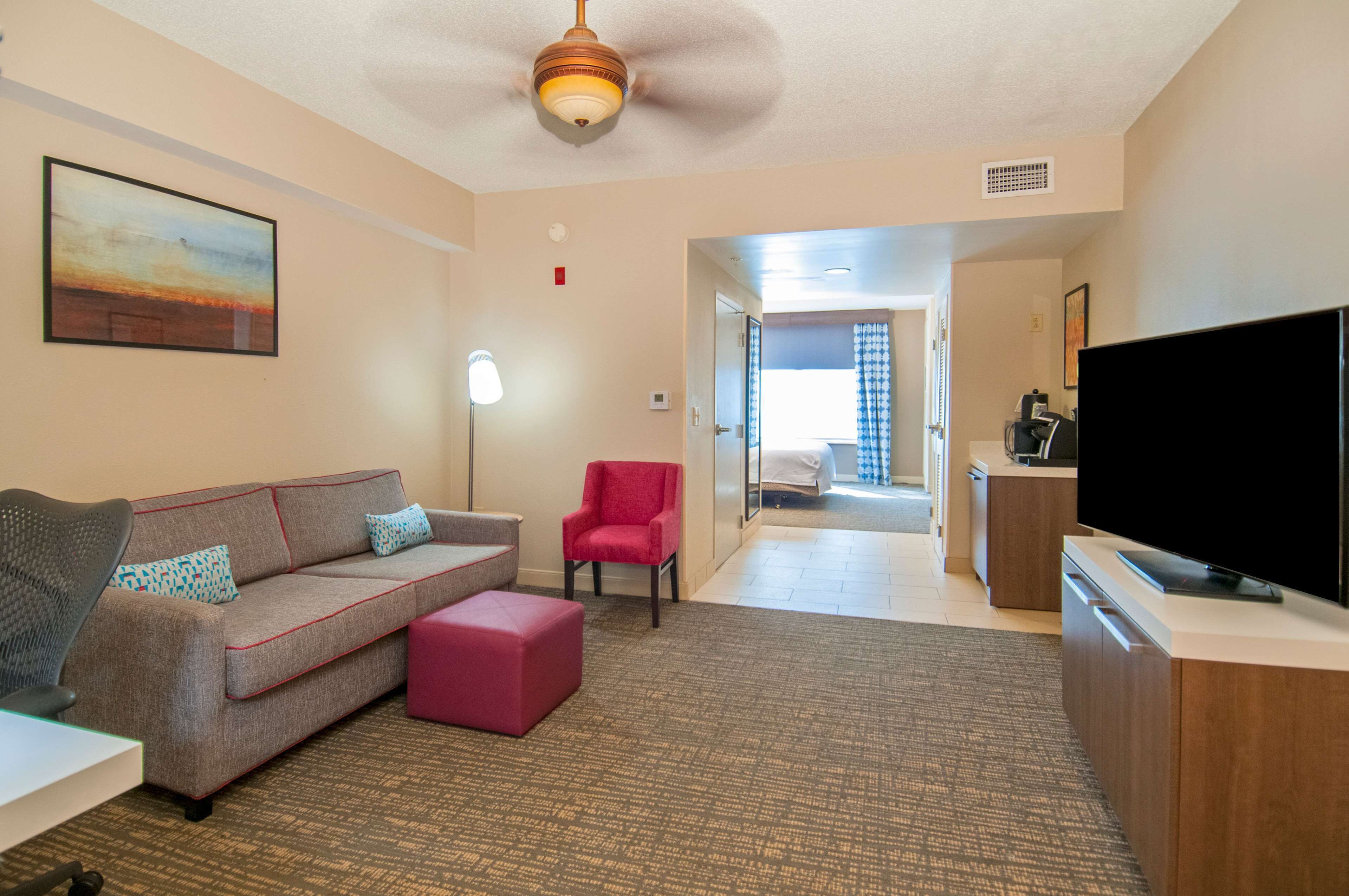 mini suite, one king bed | living area | 32-inch flat-screen tv with cable channels, tv, pay films