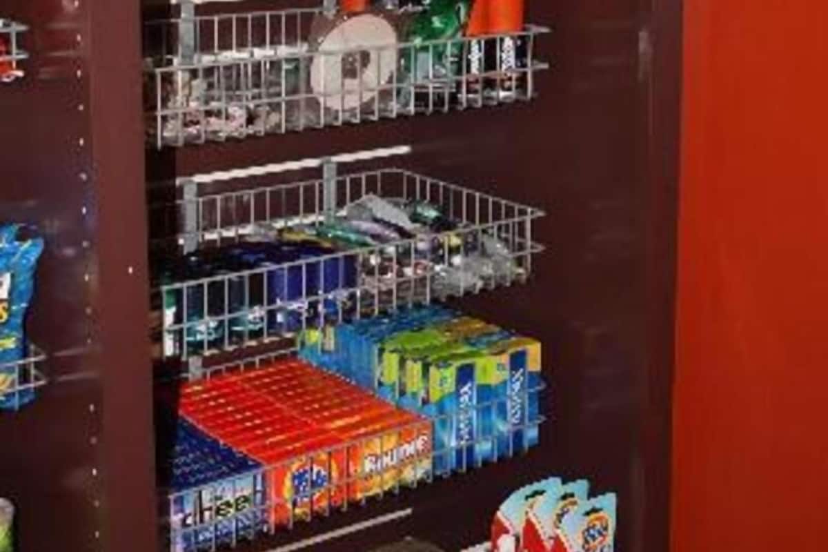 A vending machine with various snack and drink options.