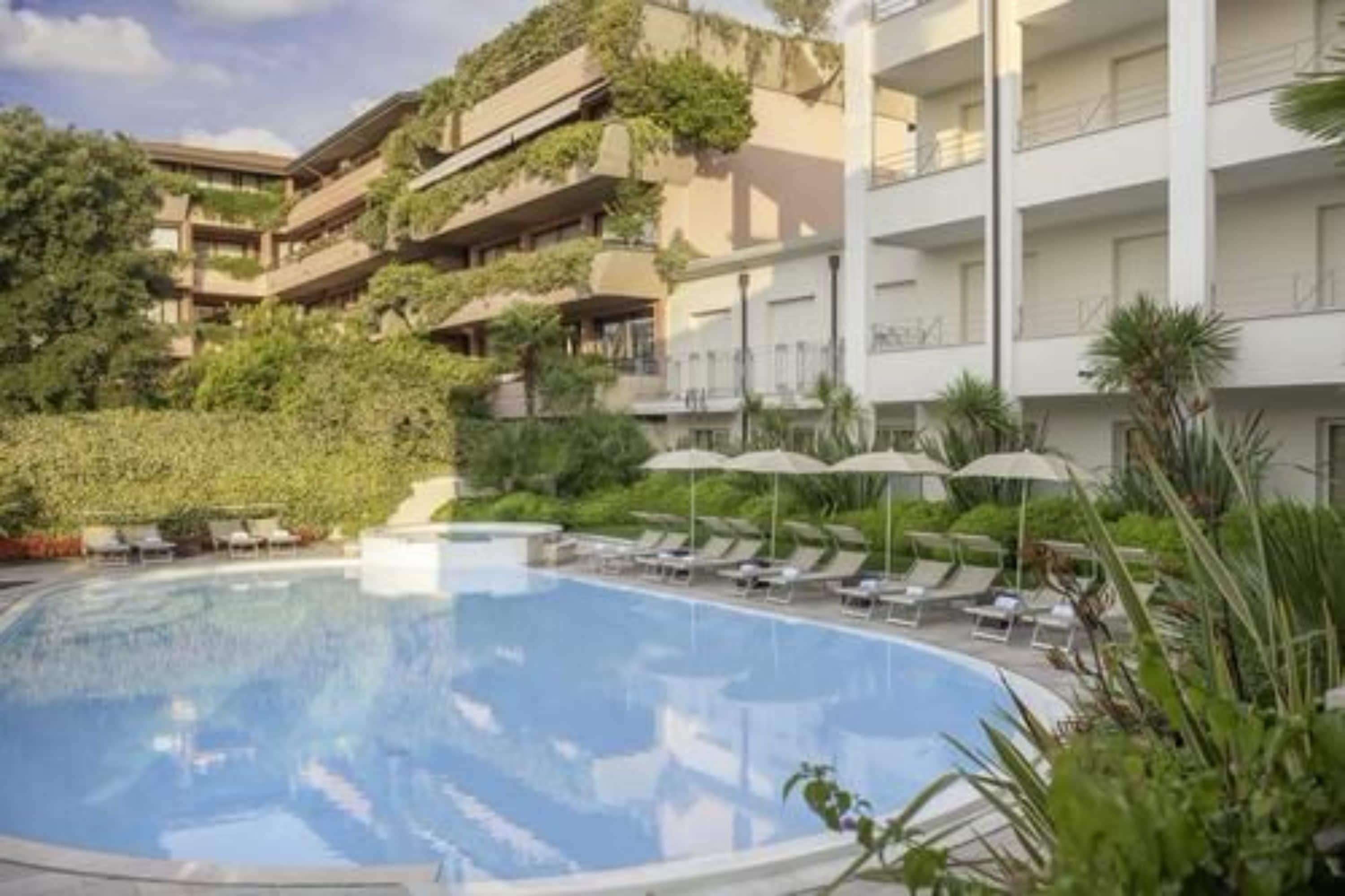 Outdoor pool, pool umbrellas, pool loungers