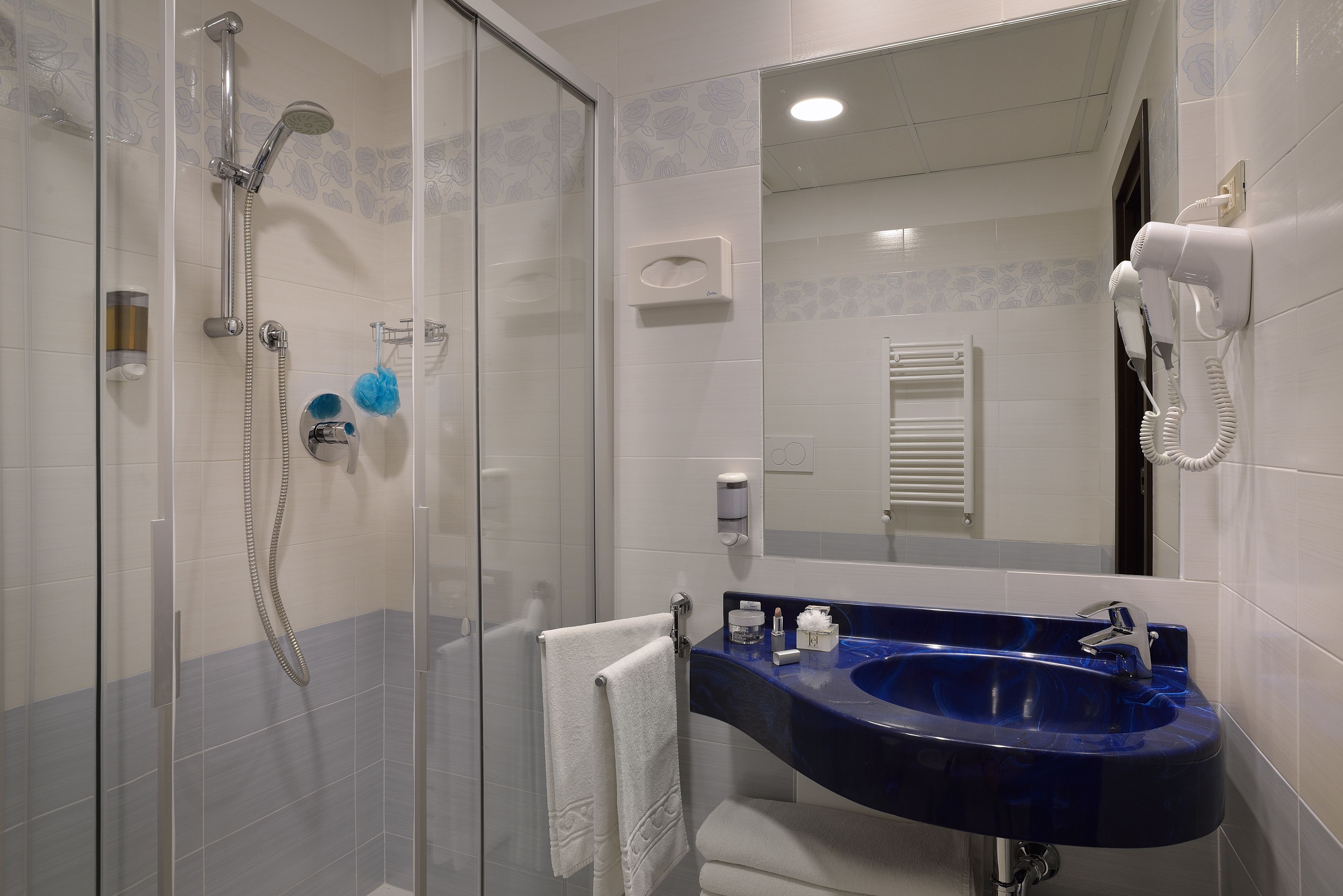 hair dryer, bathrobes, bidet, towels