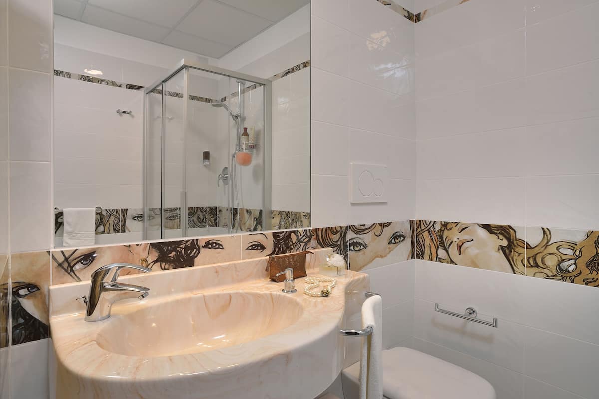 hair dryer, bathrobes, bidet, towels