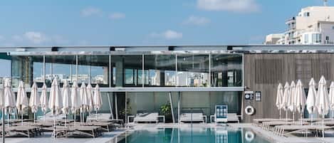 Indoor pool, outdoor pool, open 9:00 AM to 6:00 PM, pool umbrellas