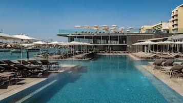 Indoor pool, outdoor pool, open 9:00 AM to 6:00 PM, pool umbrellas