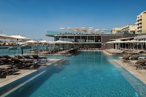 Indoor pool, outdoor pool, open 9:00 AM to 6:00 PM, pool umbrellas