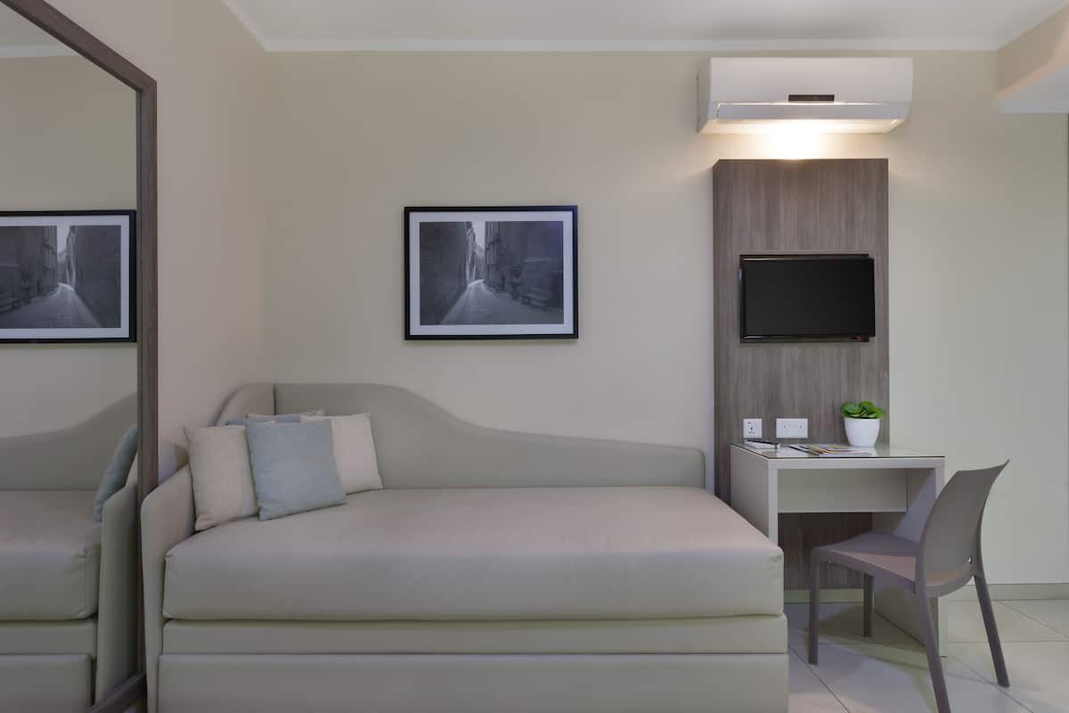 family room | minibar, in-room safe, desk, laptop workspace